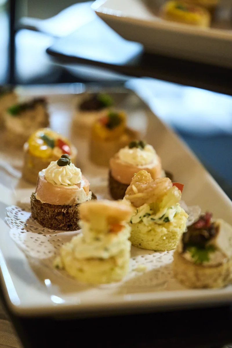 Elegant canapes and hors d'oeuvres on white serving tray at Arizona-European Young Entrepreneur Award ceremony Irish Cultural Center Phoenix corporate event food photography