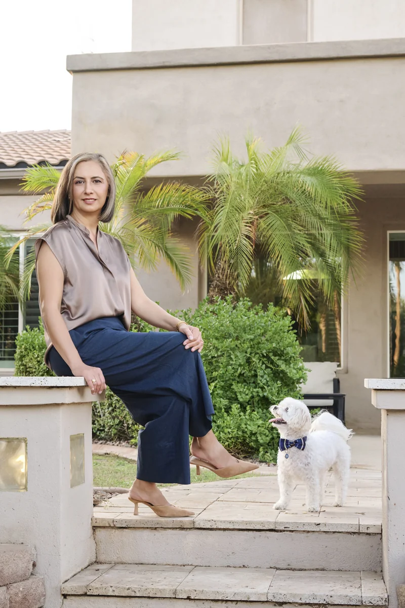 Full length portrait of a woman in a warm champagne satin top and navy trousers, an example of a coordinated color palette, photographed in Phoenix by Marie Feutrier