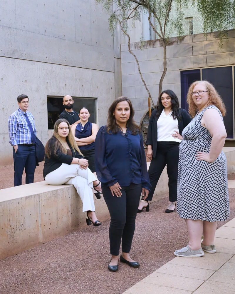 Kedia Law Firm team photo at Phoenix Art Museum courtyard with founder Pooja Kedia in front and team members staggered at different depths behind her