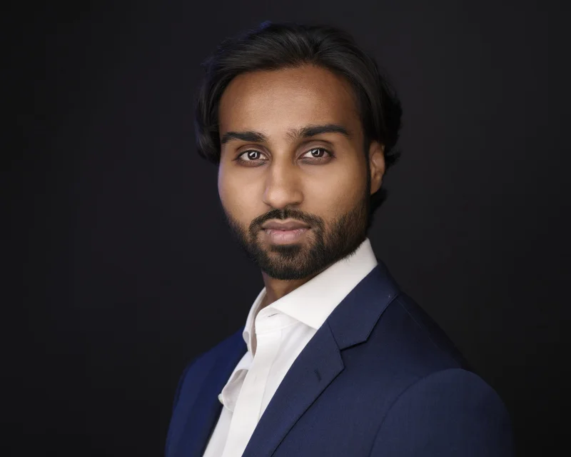 Phoenix professional in a navy blazer with no tie, the modern default for a polished headshot, photographed at Marie's Gilbert Arizona studio