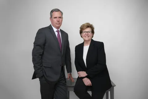 Professional law firm partners in business suits for corporate attorney headshot photography