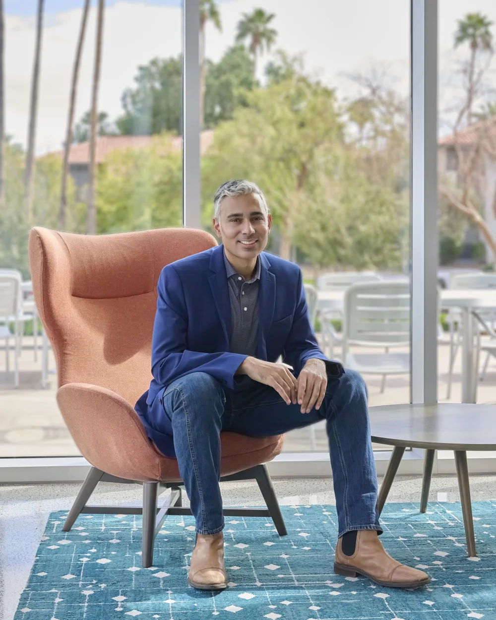 Speak Arizona event host Rupesh Parbhoo executive portrait in suit with confident smile professional headshot Phoenix Arizona