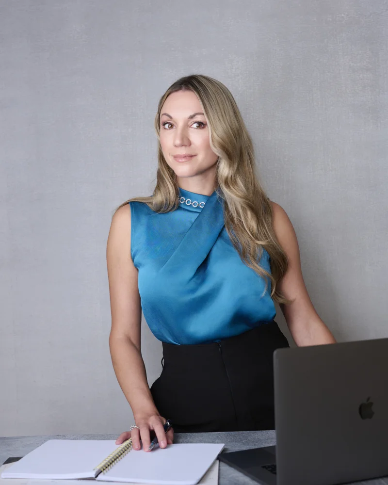 Professional headshot of executive woman at desk Phoenix Arizona