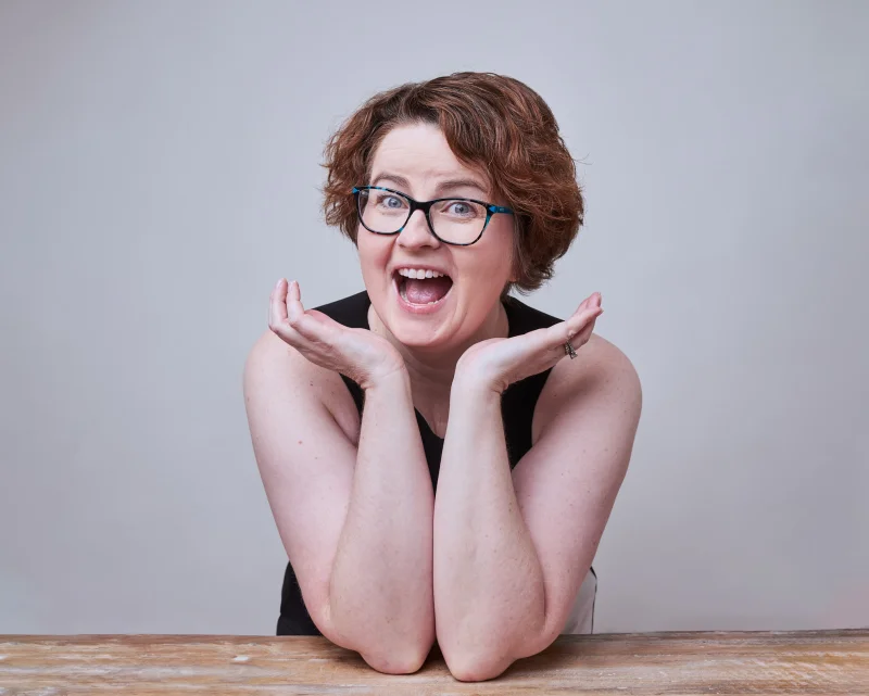 Anne McAuley Lopez, podcast host pitch portrait, polished and confident by Marie Feutrier