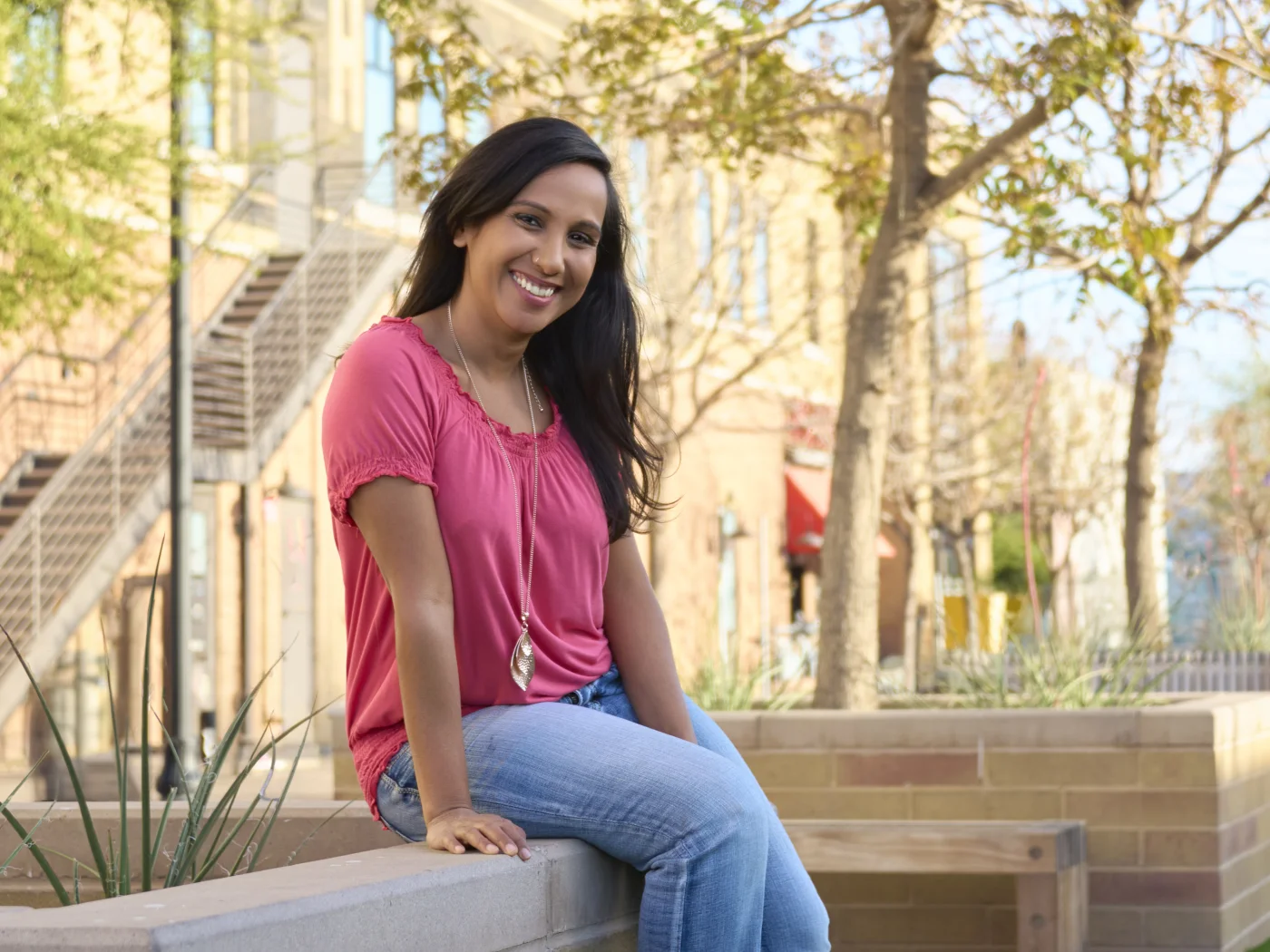 Pooja, host of Lyfting Off podcast, cinematic full-width portrait by Marie Feutrier
