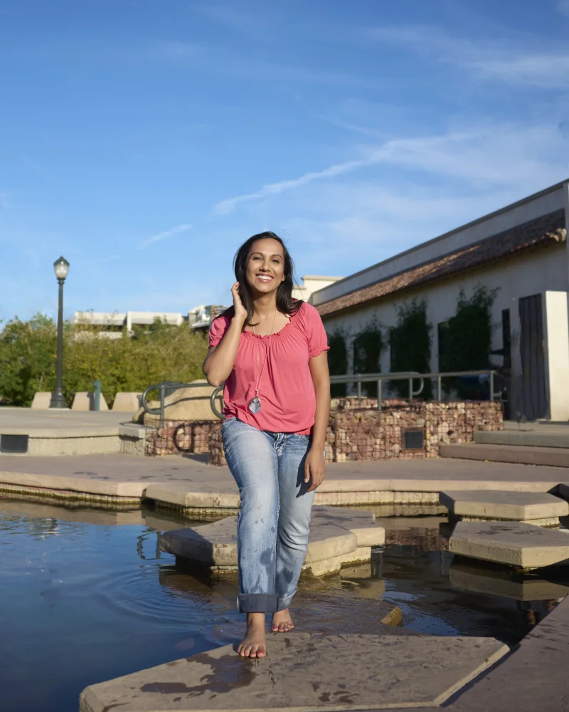 Pooja, host of Lyfting Off podcast, dynamic portrait with warm personality by Marie Feutrier