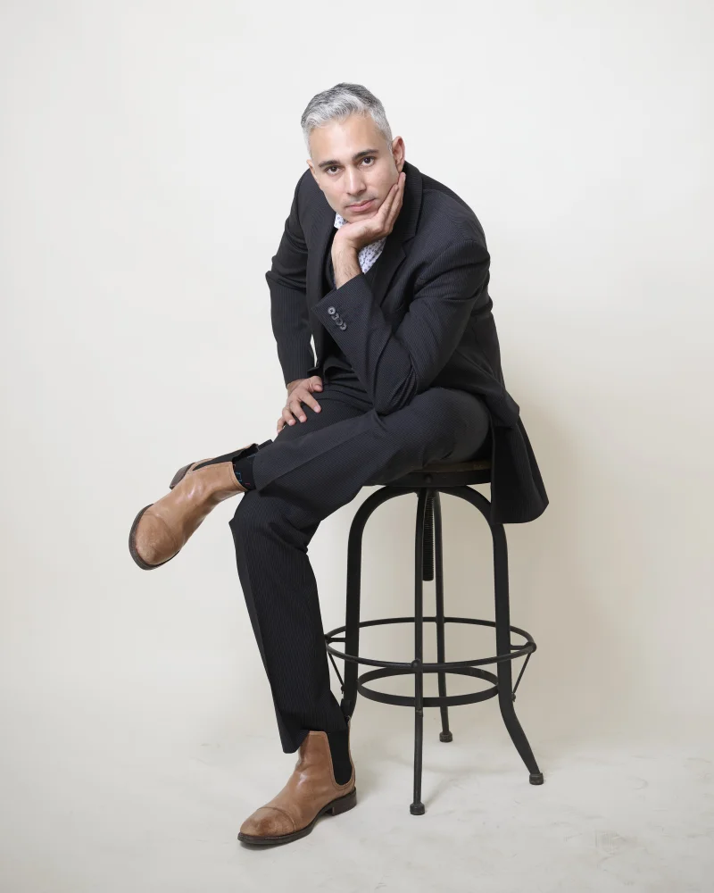 Rupesh Parbhoo, host of Speak Arizona podcast, studio portrait with dramatic lighting by Marie Feutrier